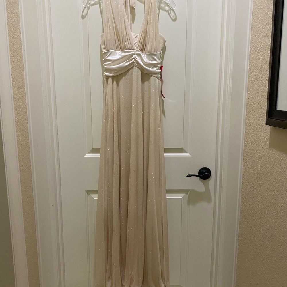 Long formal dress. Ivory in color. Size medium